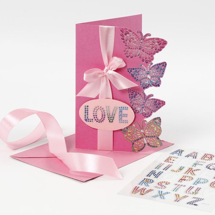 Un biglietto di auguri decorato con farfalle stickers brillanti
