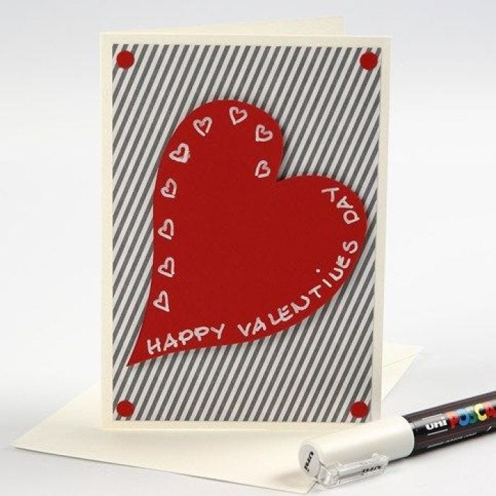 A Valentine Card with Design Paper and a Heart made from red Card