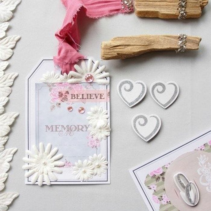 A large Gift Tag with Vivi Gade Design Paper and Decorations