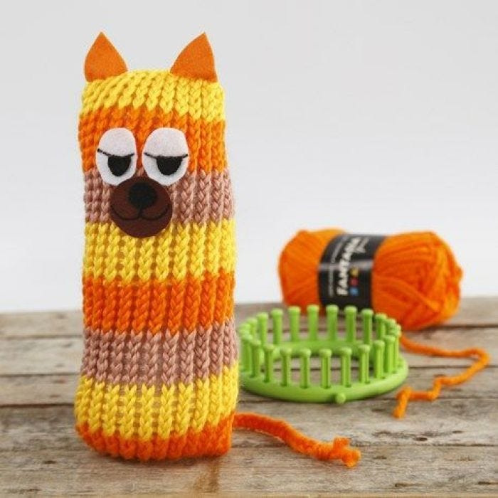 A knitted, stripy Cat made on a Knitting Loom