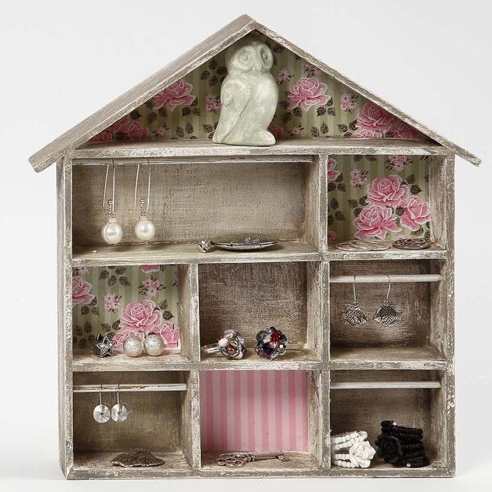 A House-shaped Shelving System with Decoupage and small Rails