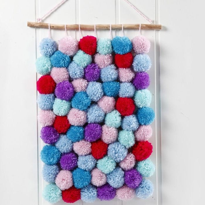 Arazzo realizzato con pom-poms