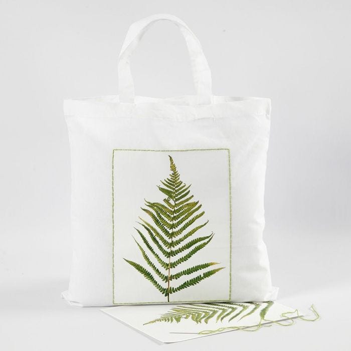 Shopping bag con fantasia a foglia e bordo ricamato