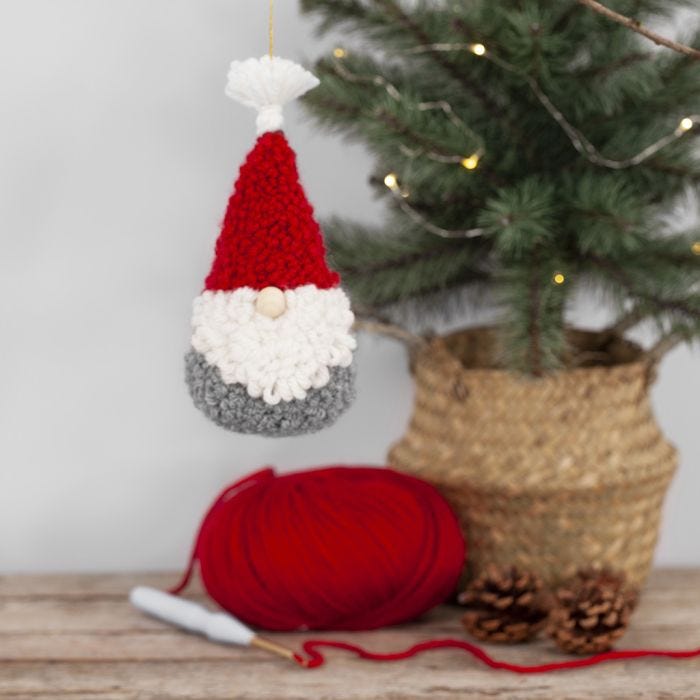 An elf hanging decoration embroidered with a punch needle