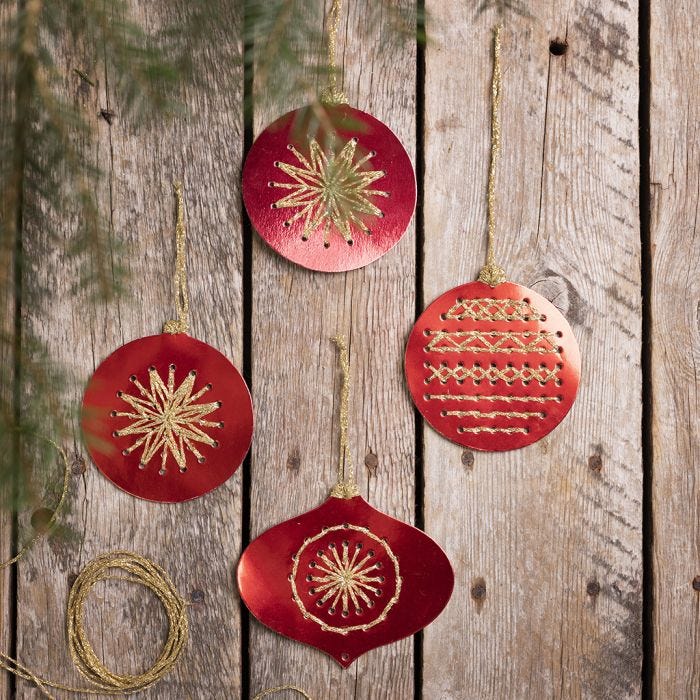 Christmas baubles from cross stitch card embroidered with gold yarn