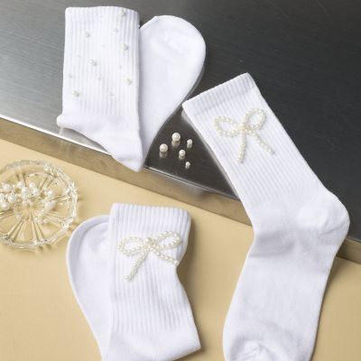 Calzini decorati con perline di cera