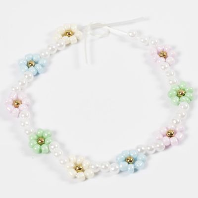 Come realizzare piccoli fiori di perline rocaille su un filo elastico