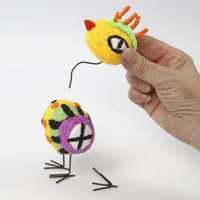 A Bird made from Foam Clay on Polystyrene Eggs with Metal Legs