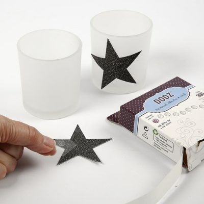 Portacandele con stelle di carta decorata