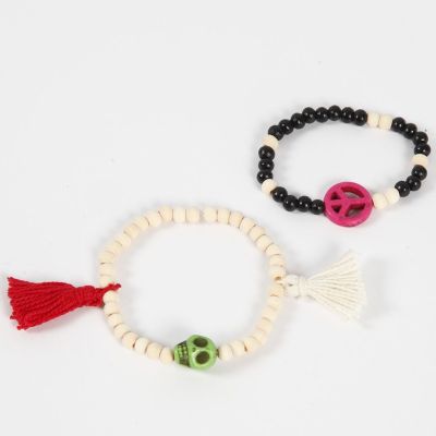 Bracciali con perle in legno e decorazioni