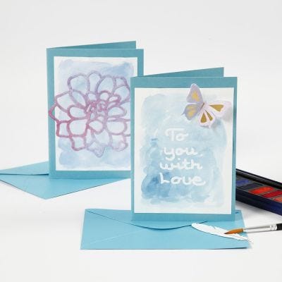 Biglietto d'auguri e segnaposto con testo in gomma da disegno e colorati con acquerelli