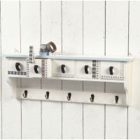 A Wooden Coat Rack with Masking Tape
