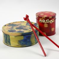 A painted Metal Tin Drum & Drumsticks made from Flower Sticks