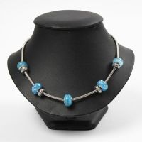 An articulated Necklace with Glass and Metal Links