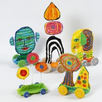 Sculptures on wheels from recycled cardboard and gauze bandage